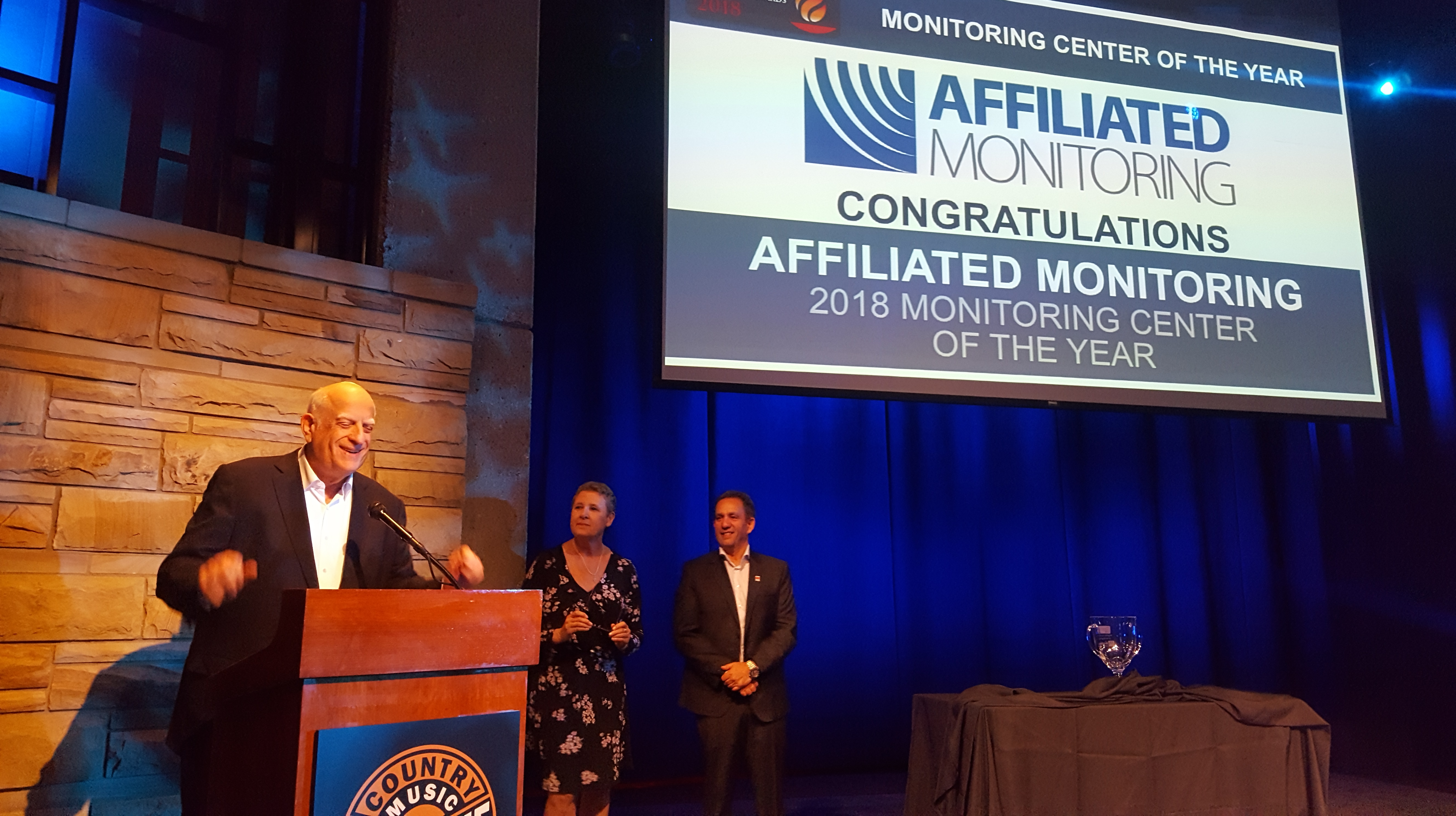 Affiliated Monitoring receiving its 2018 Monitoring Center of the Year recognition at an industry event