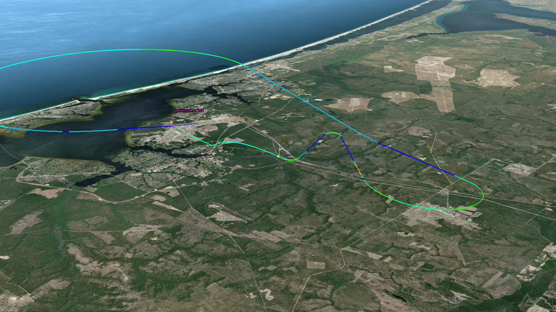 TETK product screenshot showing a color-coded F-35 flight route and a ground station on coastal terrain