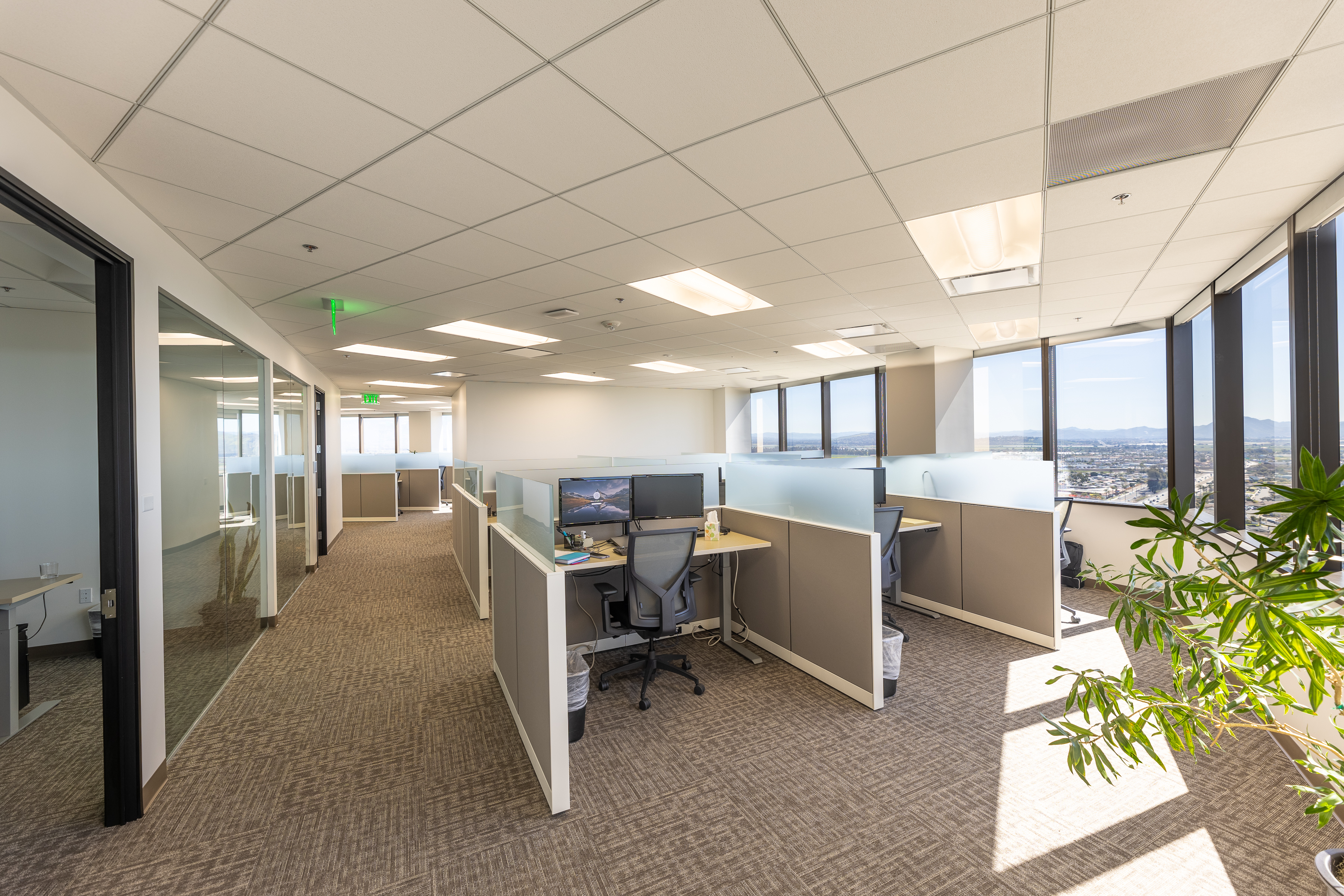 Workstations inside AGIA’s Oxnard office, shown in its relocation announcement