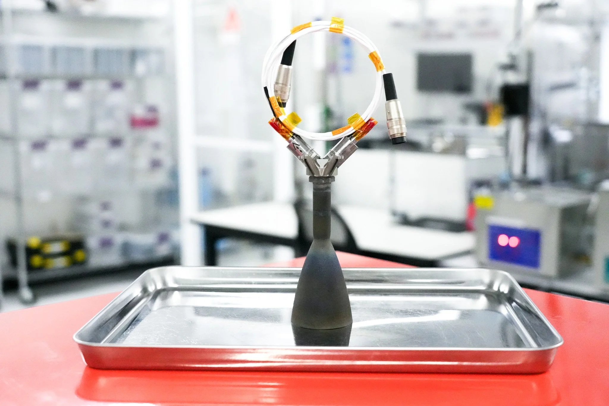 Agile DS110 thruster standing on a metal tray in a manufacturing facility