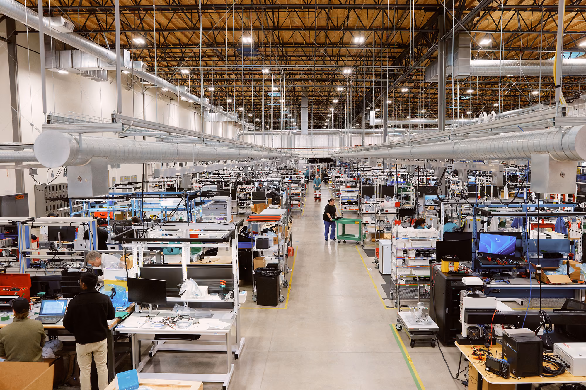 Team members at workstations inside Agility’s RoboFab manufacturing facility