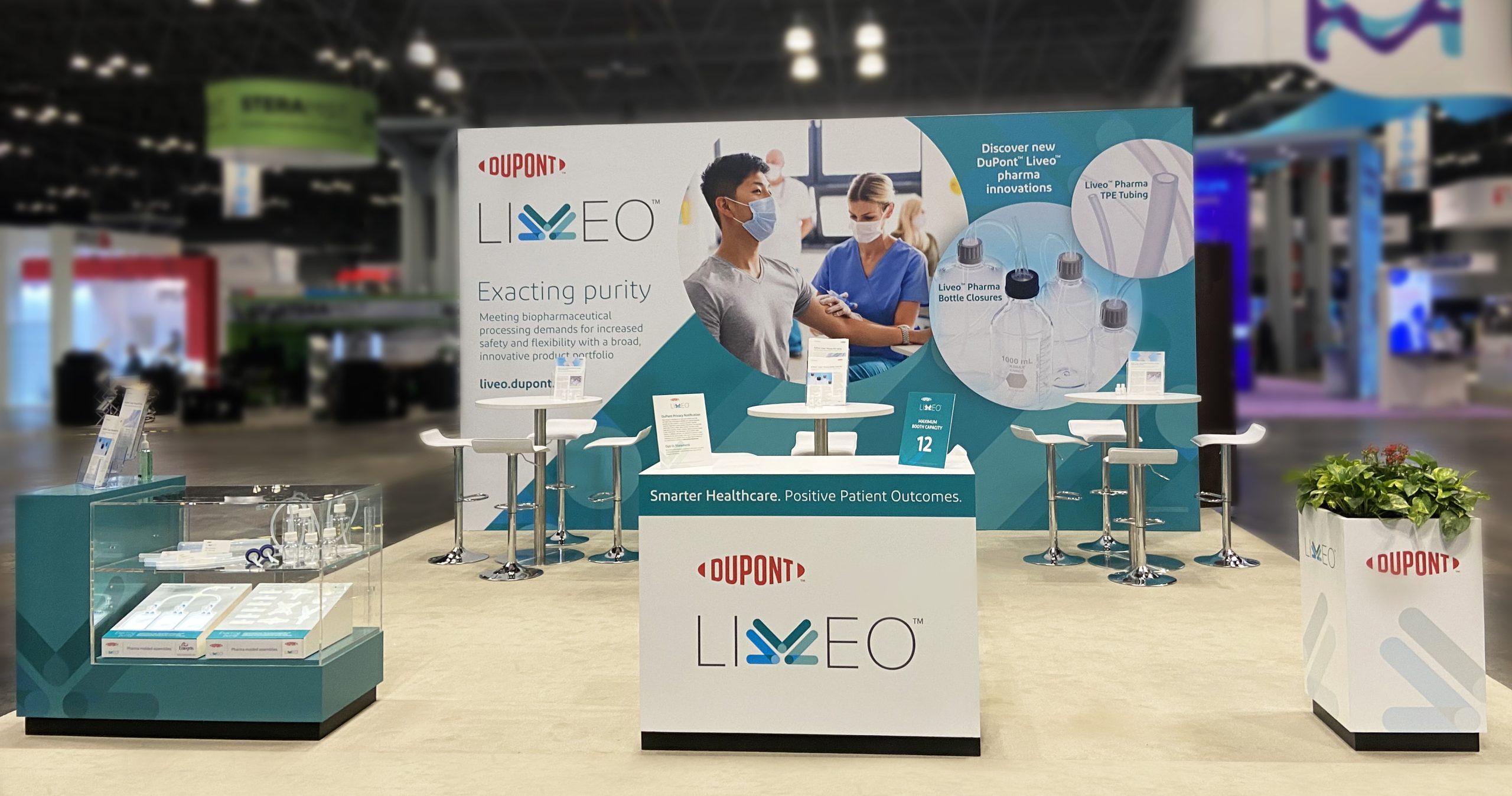 DuPont Liveo biopharmaceutical trade-show exhibit with product displays and seating