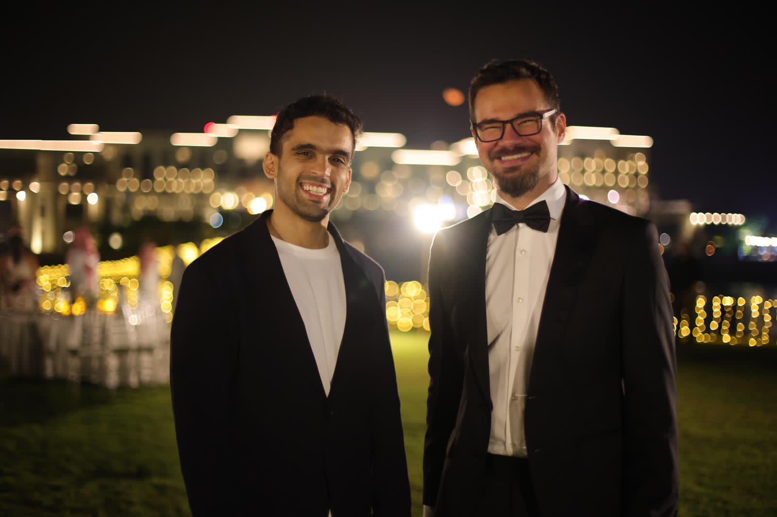 Ahmed Al Rawi, right, wearing a bow tie beside Khwarizmi Ventures’ managing partner at an evening event