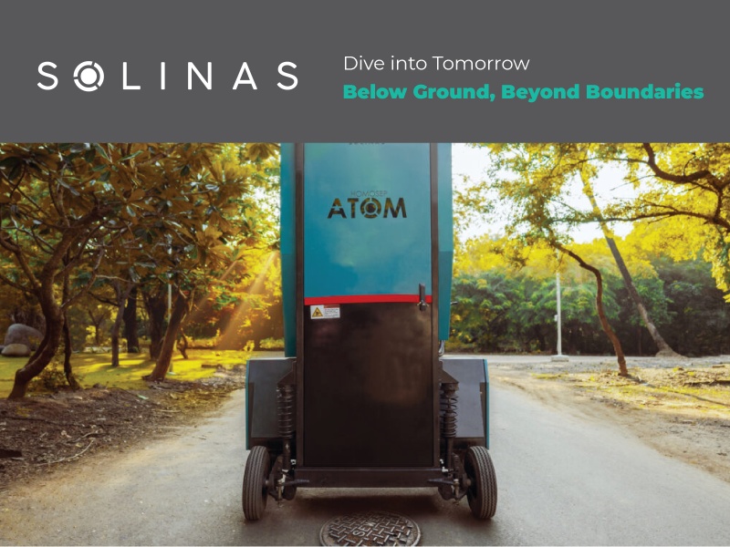 Solinas promotional photograph of its wheeled HomoSEP Atom machine beside a manhole