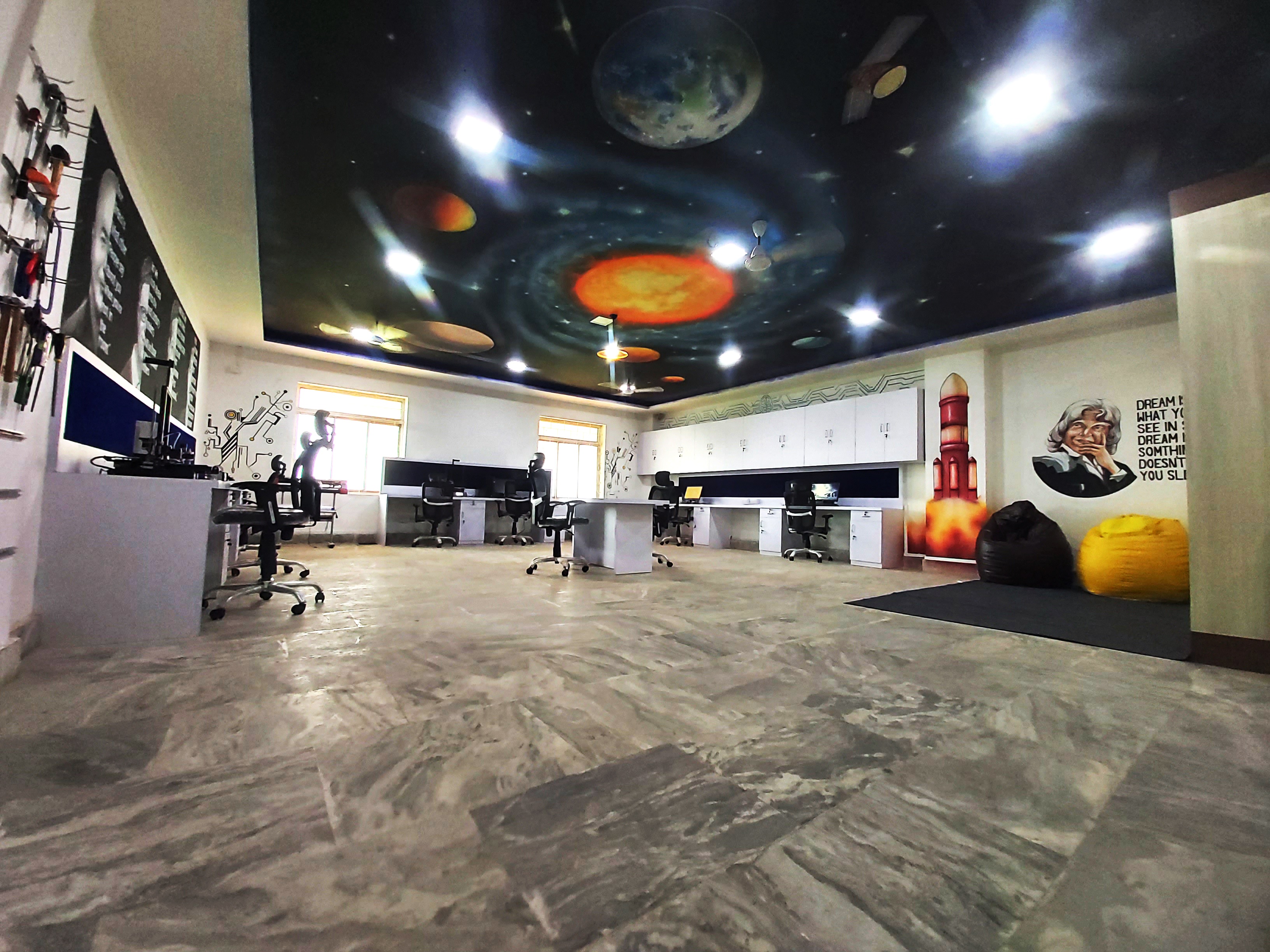 AIC-Nalanda FabLab with workstations, tools and a solar-system ceiling