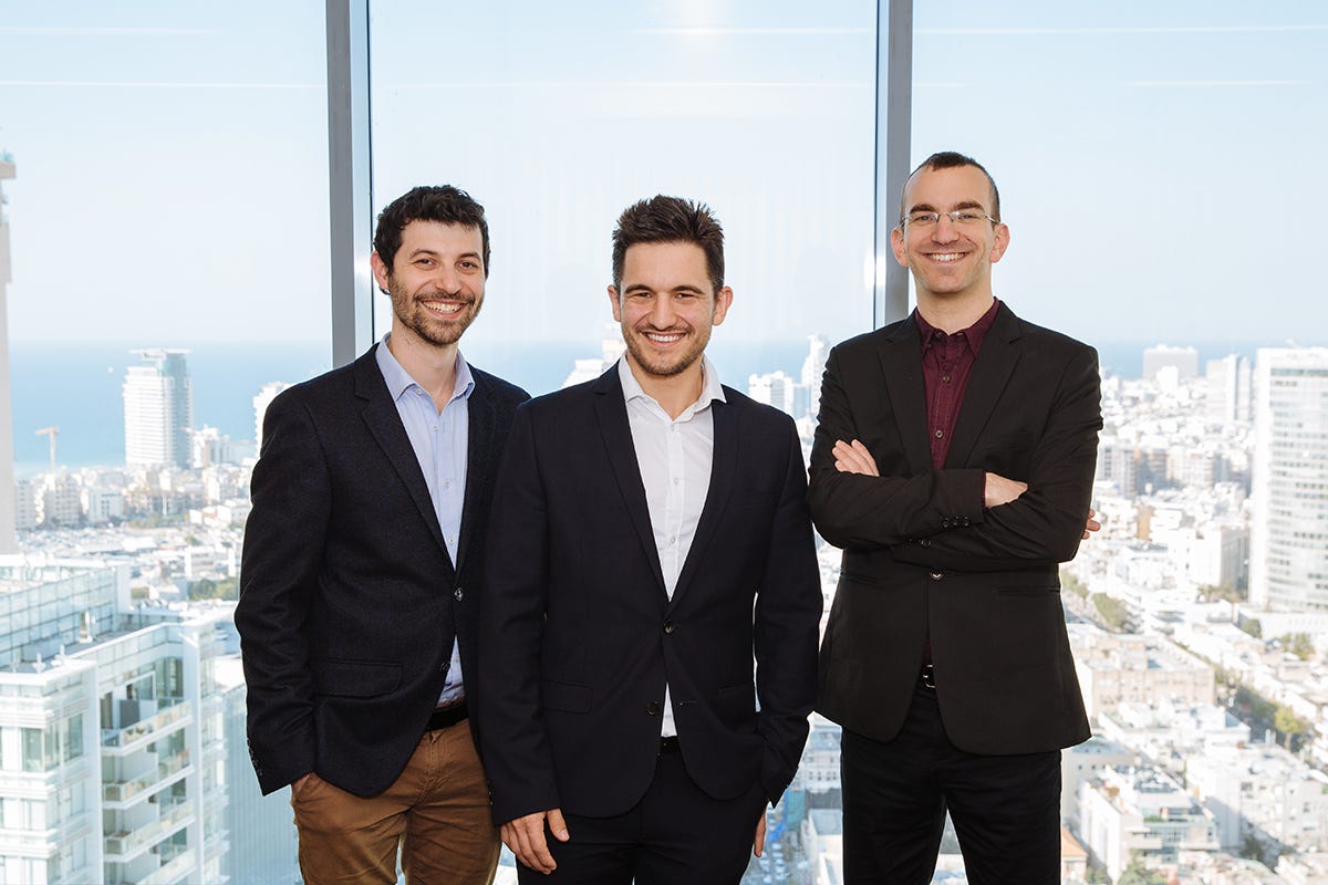 Aidoc founders Michael Braginsky, Elad Walach and Guy Reiner standing together in an office