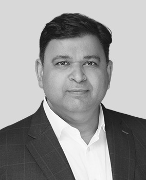 Black-and-white portrait of Airo founder and CEO Dev Singh