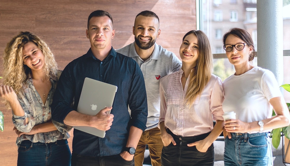 Five airSlate colleagues together in a bright office