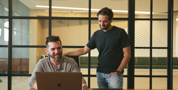 Airspace co-founders Ryan Rusnak on the left and Nick Bulcao on the right collaborating at a desk