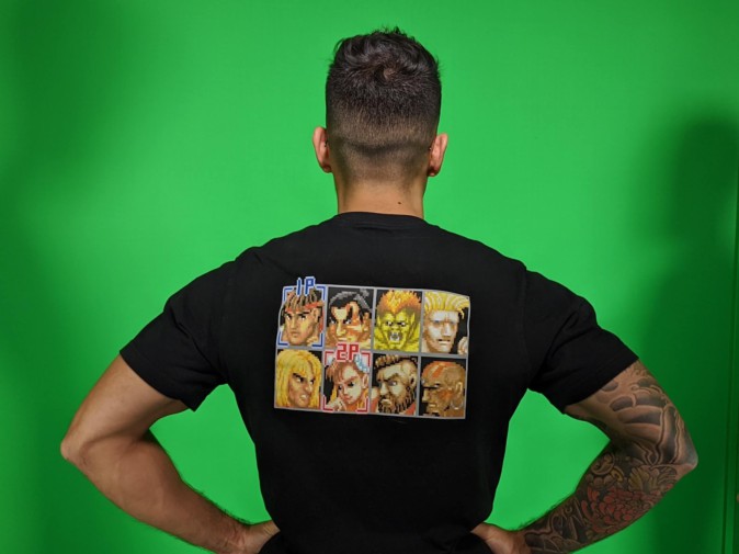 AJ Shewki facing a green screen in a Street Fighter character T-shirt at LIV’s Prague office