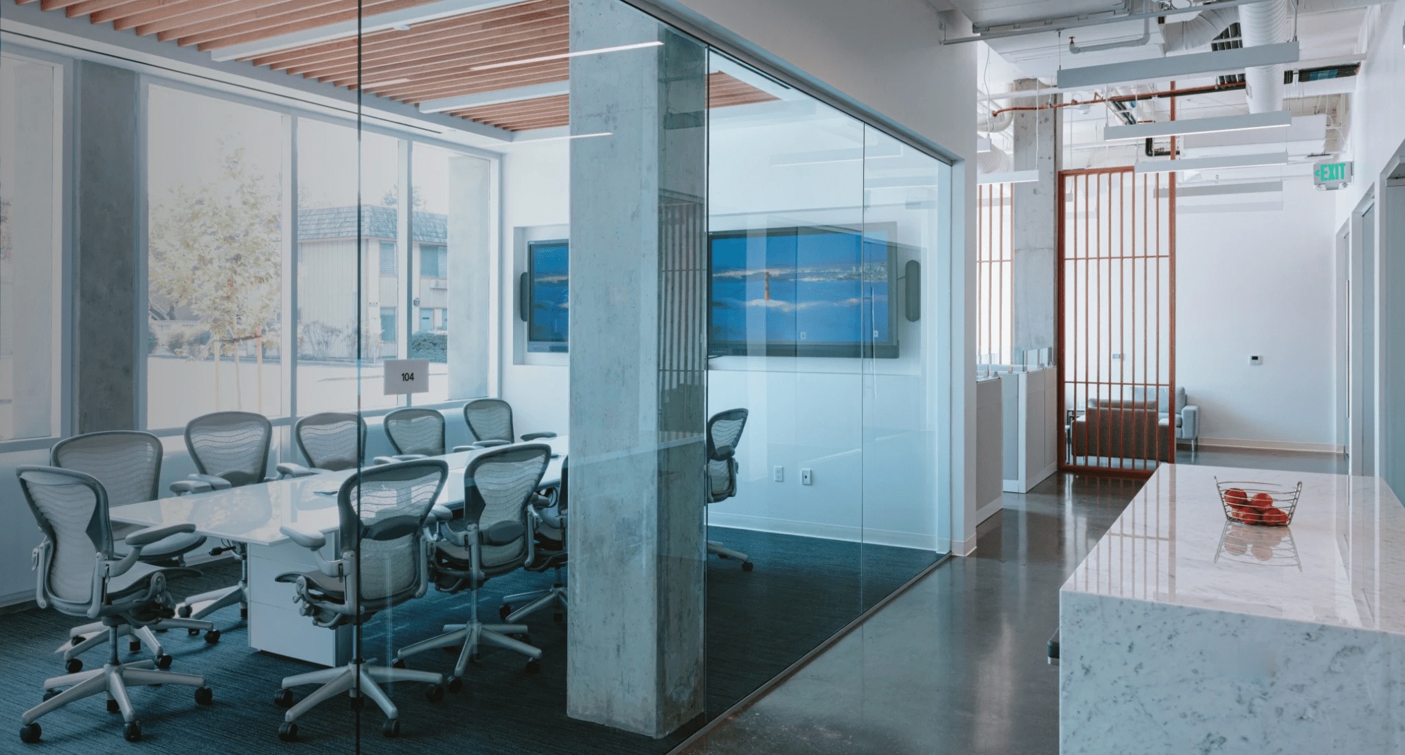 Glass-walled conference room pictured on Ajax Health’s contact page