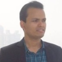 Ajay Bidyarthy in a blazer and checked shirt, as pictured on Netclan’s team page