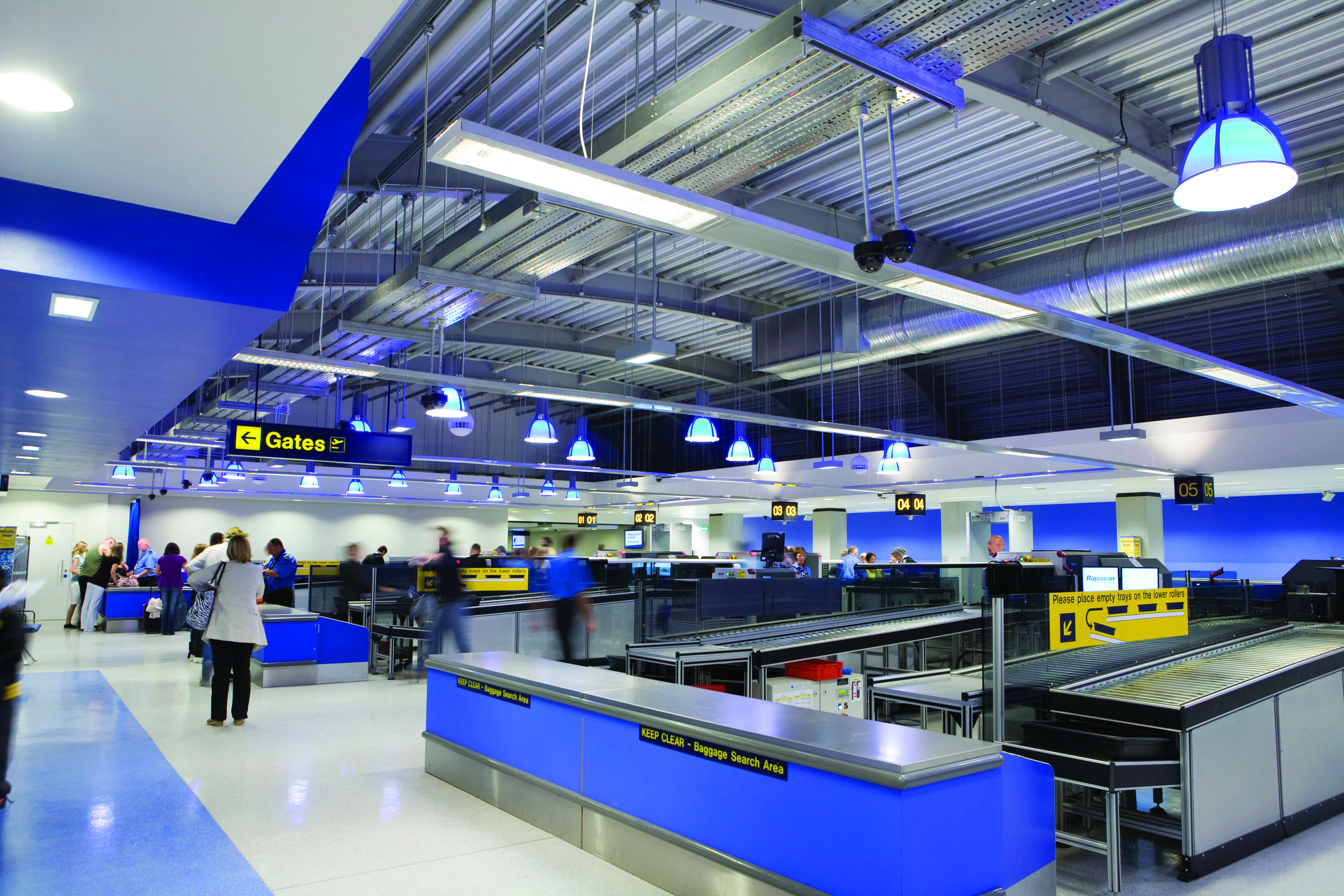 Rapiscan screening lanes and baggage trays inside Manchester Airport