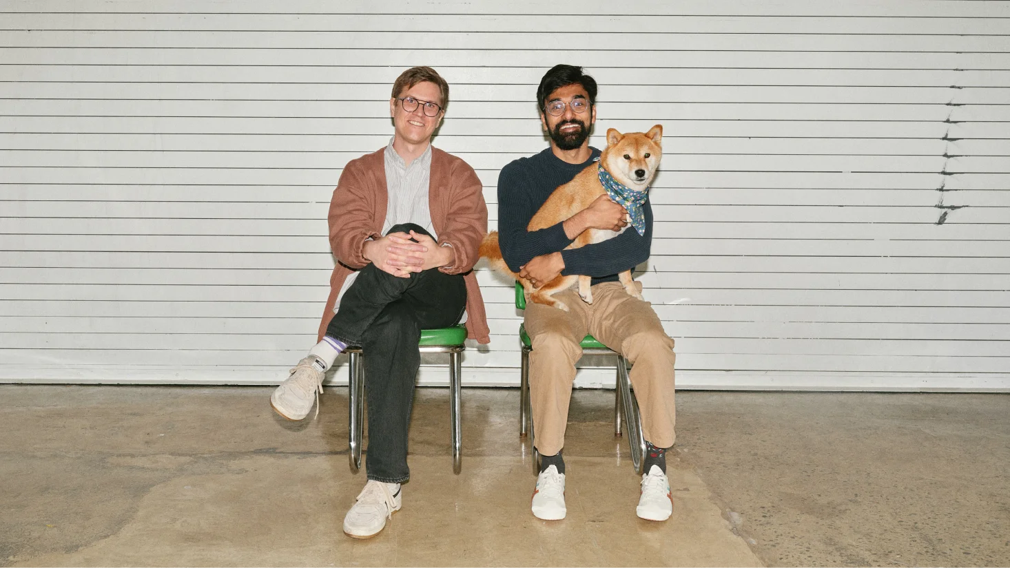 Modal co-founders Erik Bernhardsson and Akshat Bubna seated with Bubna's dog Mugi