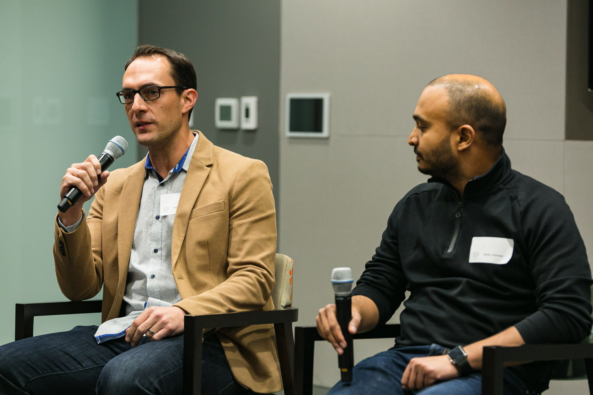 Akshay Krishnaiah, seated on the right with a microphone, at a fintech panel