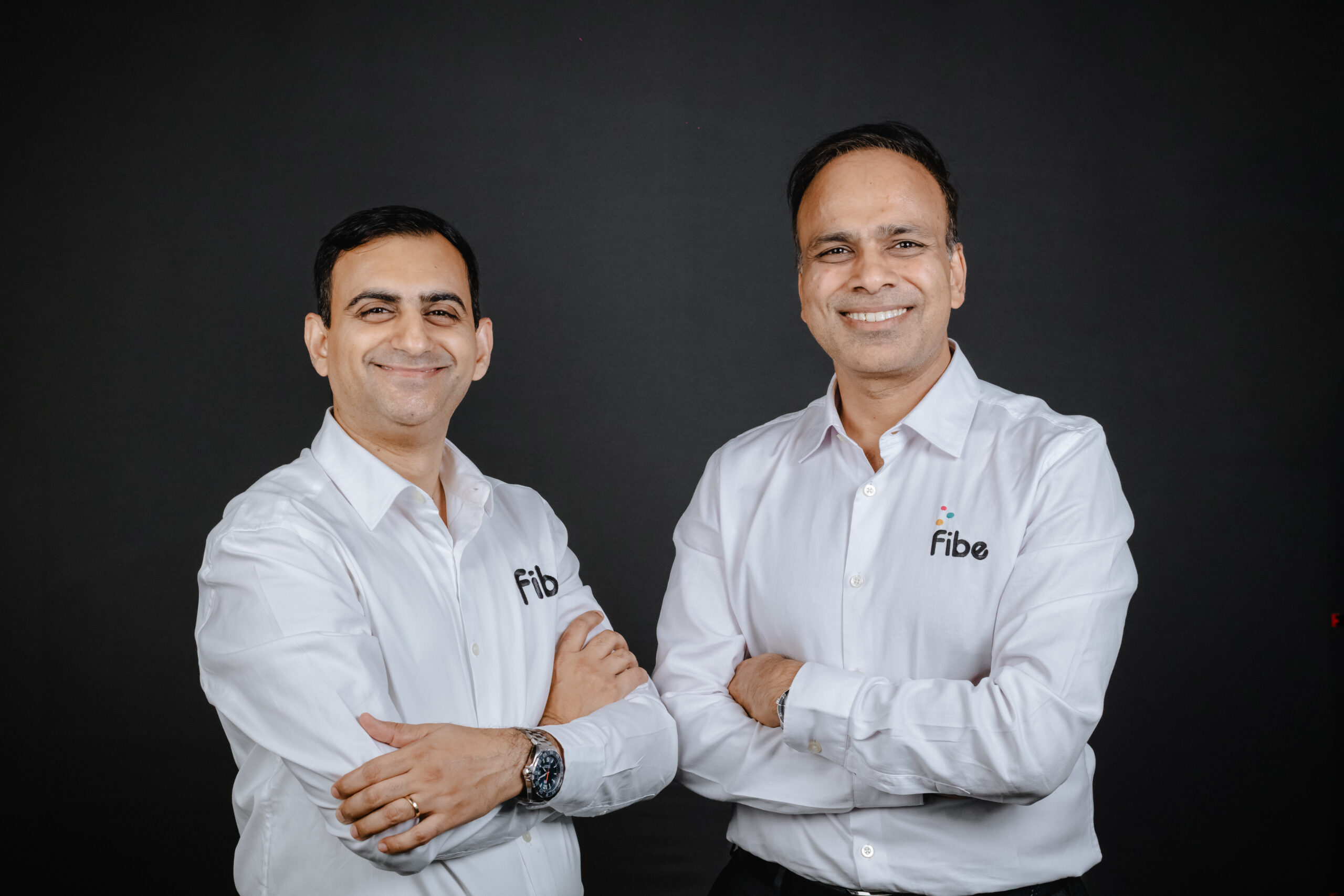 Fibe cofounders Akshay Mehrotra, left, and Ashish Goyal, right, wearing white Fibe shirts