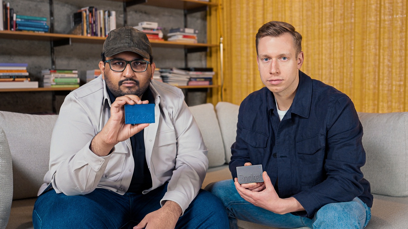 Akshay Narisetti and Gabriel Dymowski seated together, each holding a Pocket device