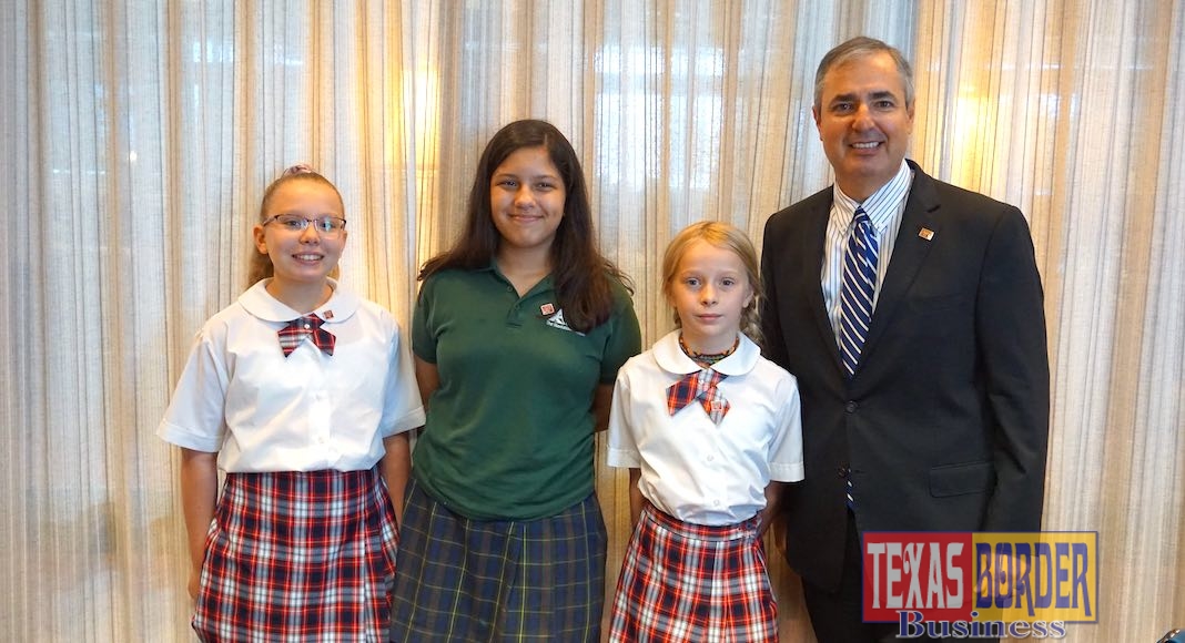 Three student bank presidents stand beside Al Villarreal, at right, during a Brownsville Minitropolis mentoring event