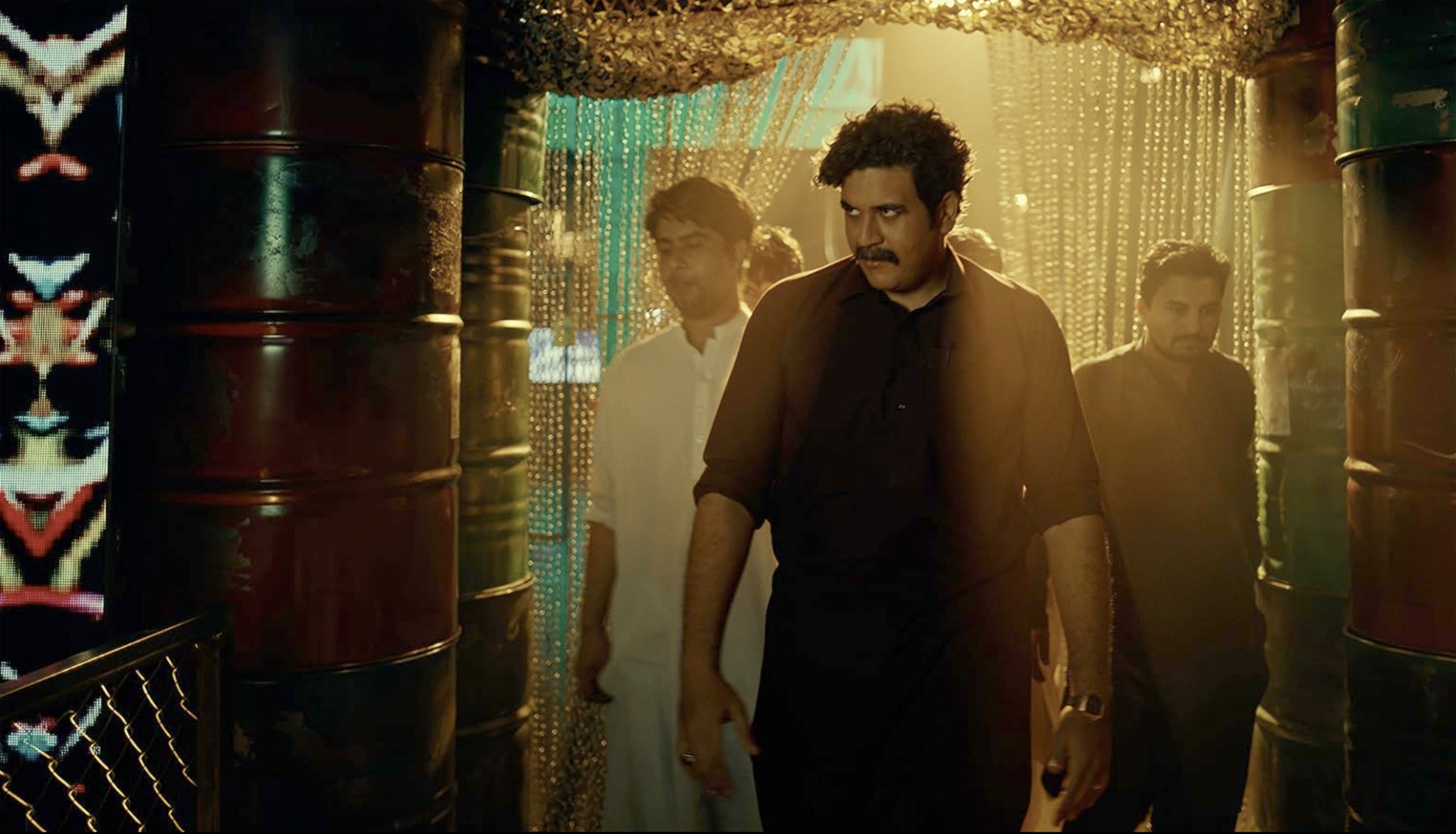 A scene from Sattar showing its lead character entering a wrestling venue