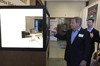 Albert Nahmad and his son exploring the MagicBox display at the Panama Canal Gallery
