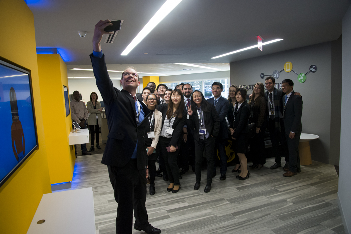 Global Network Week participants gathering for a group selfie during a visit to Synchrony