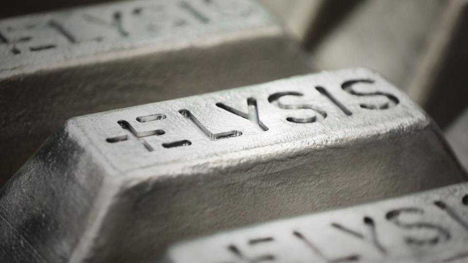 Silver aluminum ingots stamped with the ELYSIS name