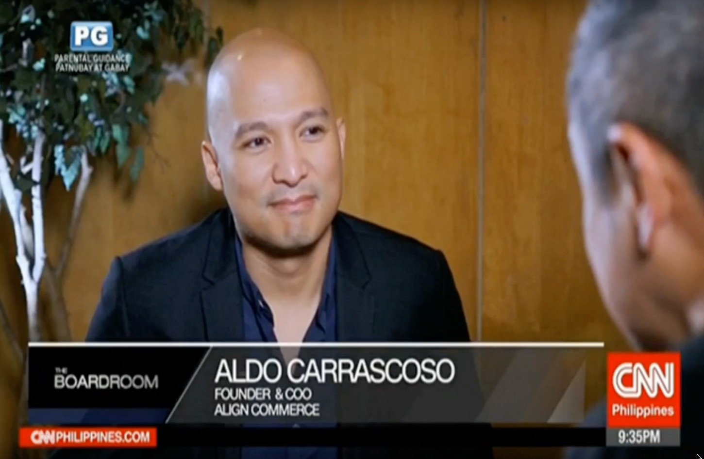 Aldo Carrascoso speaking with an interviewer on CNN Philippines’ The Boardroom, identified on screen as Align Commerce founder and COO.