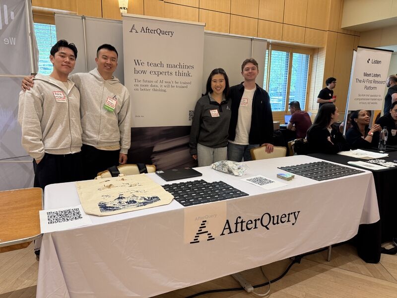 Alec Zhou and three AfterQuery colleagues at a university career fair booth
