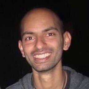 An archival photograph of Aleem Mawani smiling