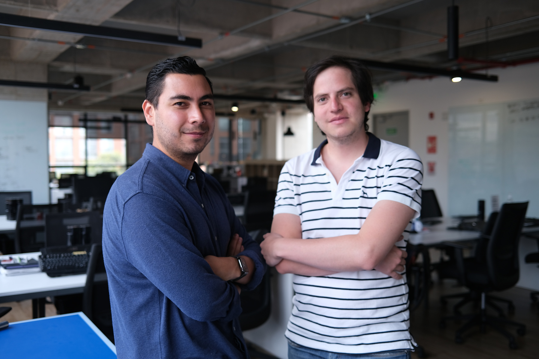 Santiago Gómez on the left and Alejandro Casas on the right in an office