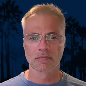 Aleks Ivanovic wearing glasses in a second public headshot