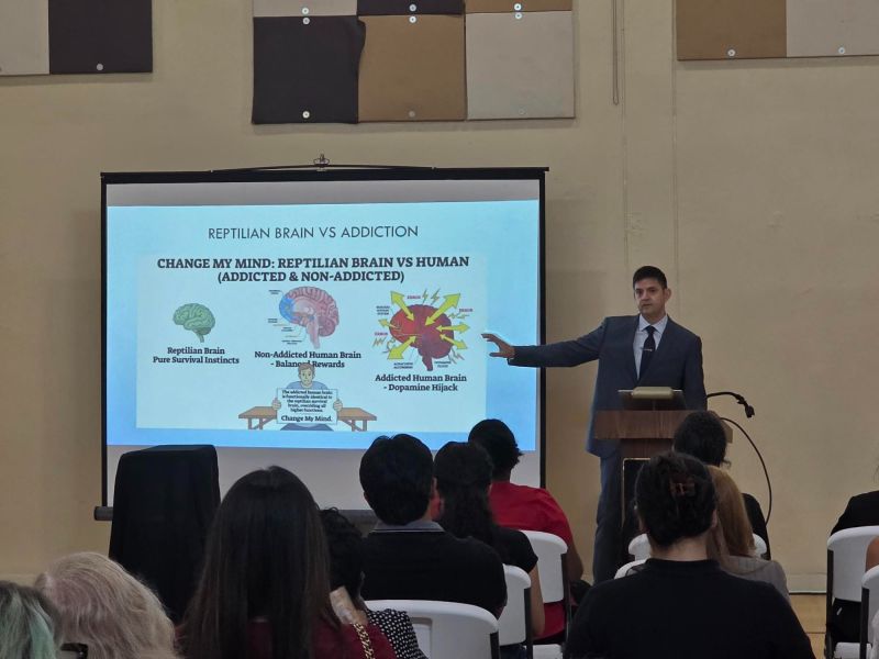 Aleksandr Zverinskiy presenting to a seated professional audience at Central Florida Behavioral Hospital