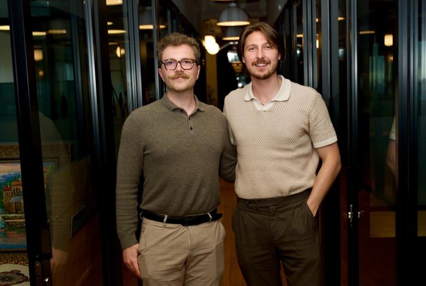CareCycle co-founders Evan Roubekas and Alex Doonanco standing together indoors