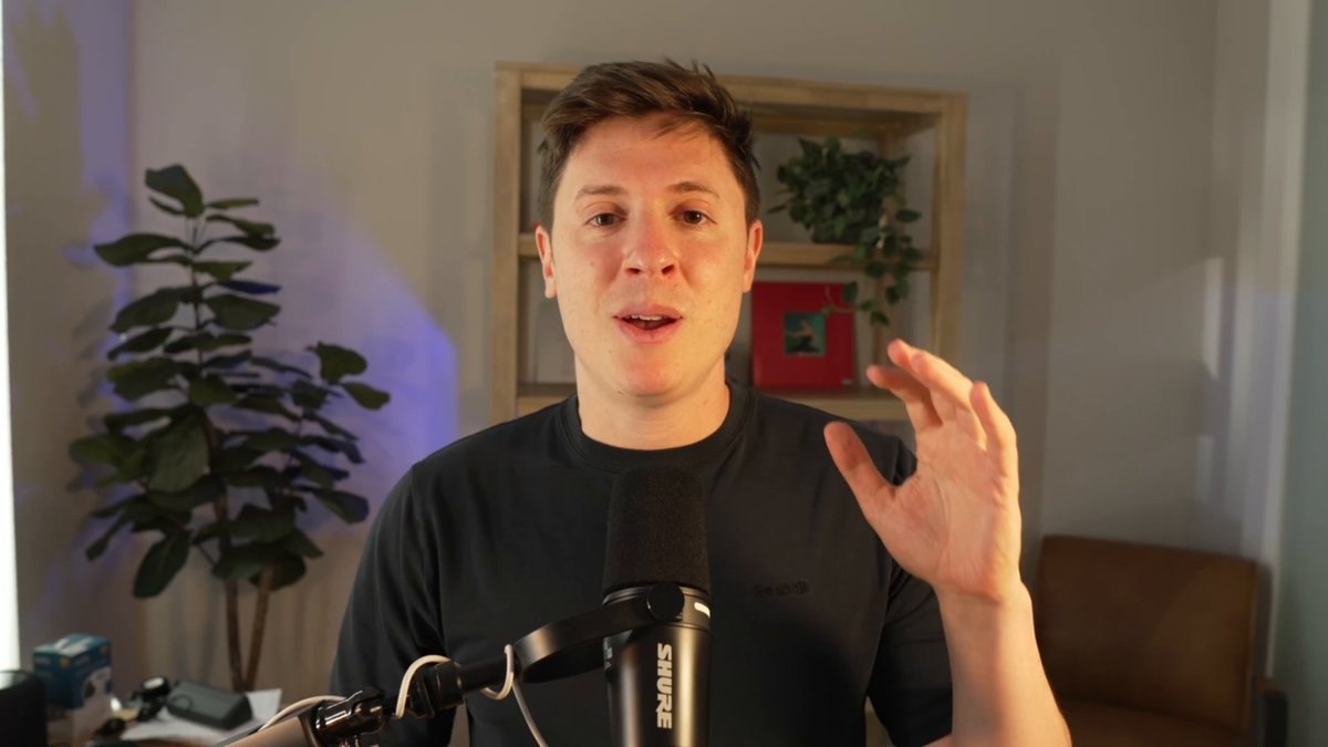 Alex Finn speaking into a studio microphone during a recorded tutorial