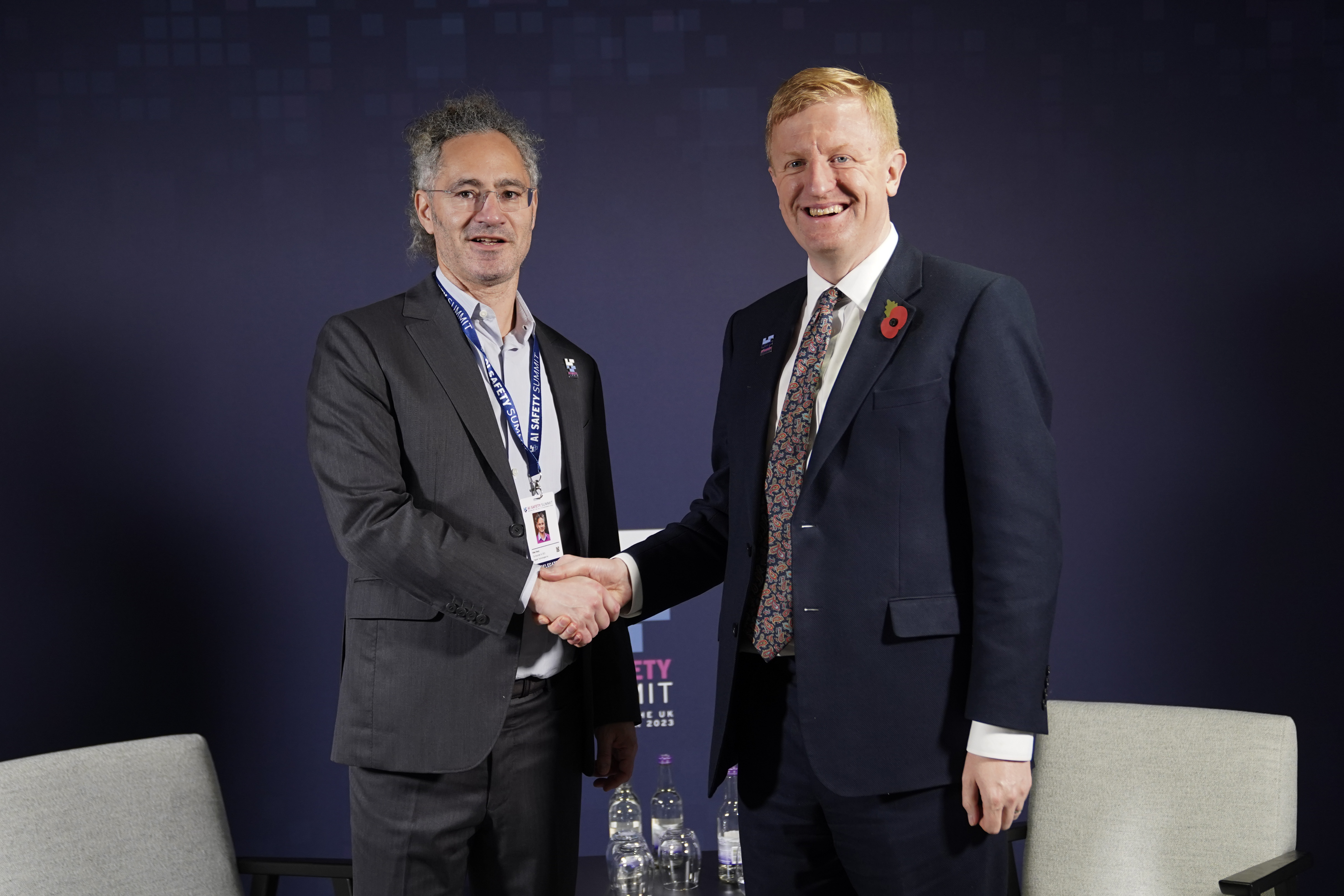 Alex Karp and UK Deputy Prime Minister Oliver Dowden shake hands at Bletchley Park’s AI summit in November 2023