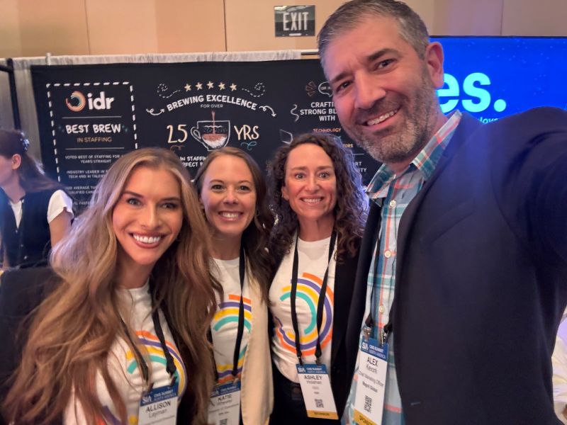 Alex Kevork taking a group photo with three industry colleagues at the 2025 CWS Summit
