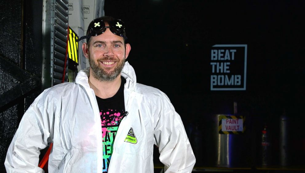 Alex Patterson wearing a protective suit at Beat The Bomb in Brooklyn