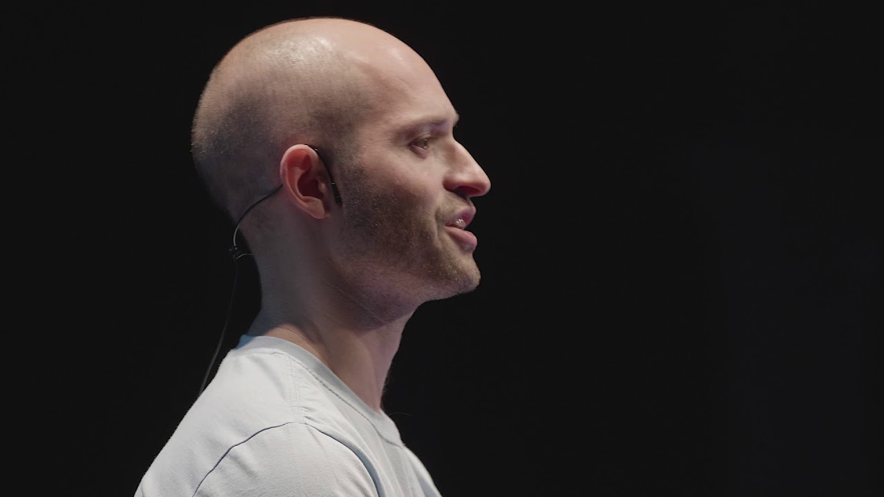 Alex Stephany speaking with a headset microphone at TEDxBrighton
