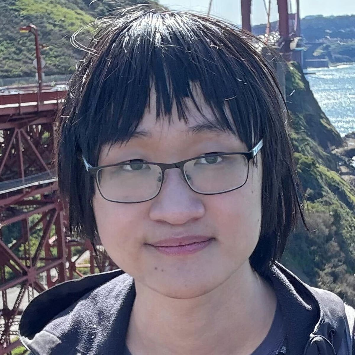 Alex Yu outdoors near the Golden Gate Bridge