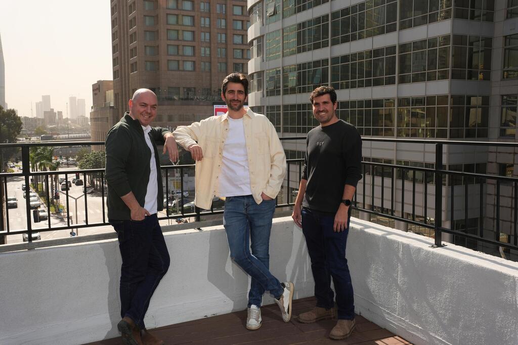 Chamelio’s three co-founders standing together on an outdoor terrace