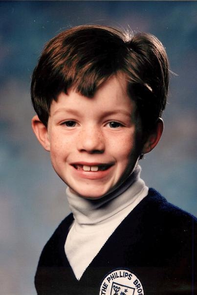 Alexander Kvamme as a child, wearing a Phillips Brooks School sweater, circa 1995