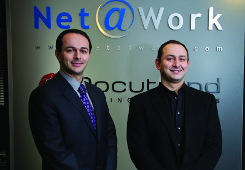 Edward Solomon, left, and Alexander Solomon, right, standing together at Net at Work