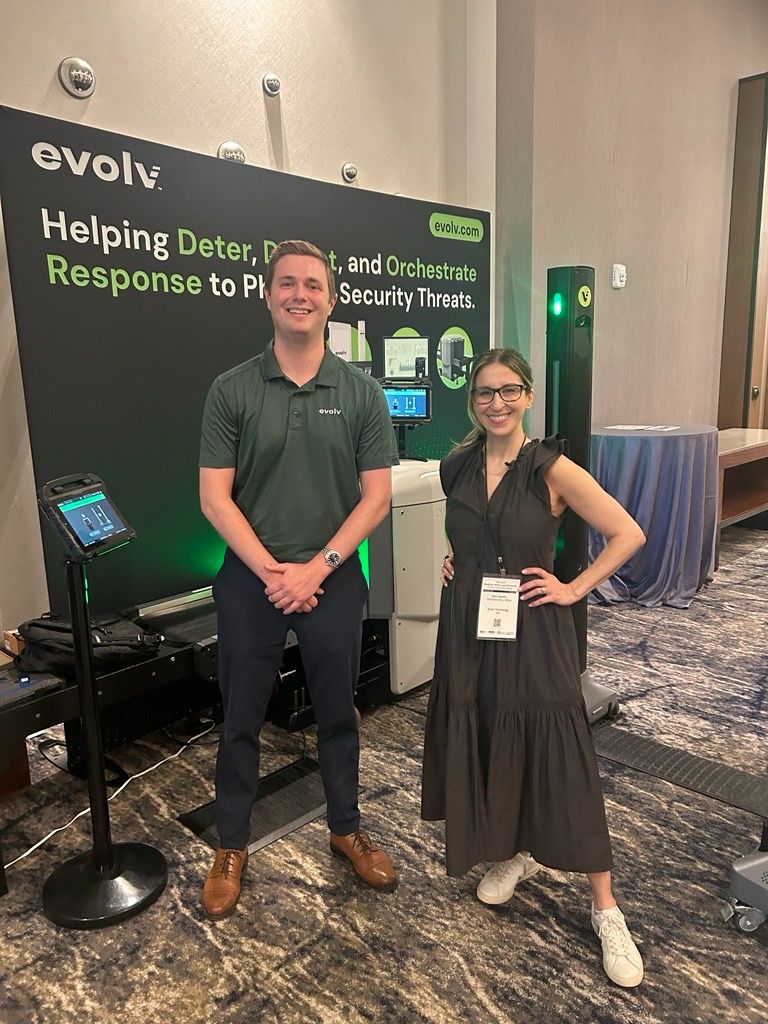 Alexandra Ozerkis and an Evolv colleague beside security screening equipment at a 2026 school safety conference