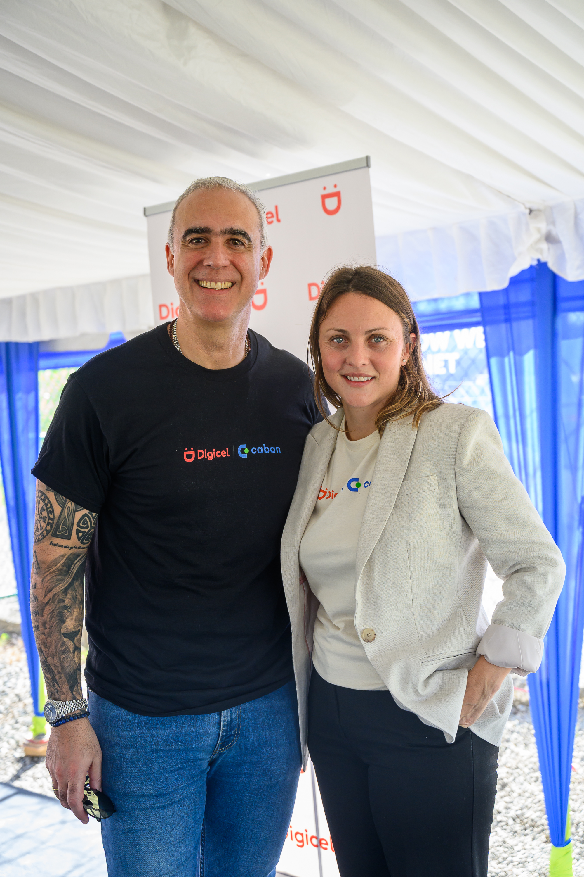 Digicel Group CEO Marcelo Cataldo standing beside Alexandra Rasch Castillo at the Jamaica partnership launch