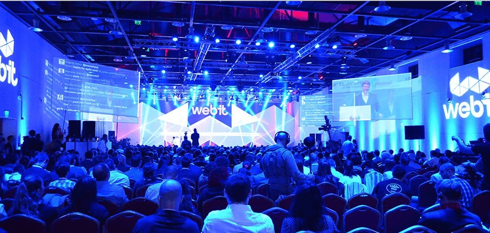 The auditorium and blue-lit stage at WEBIT in Sofia