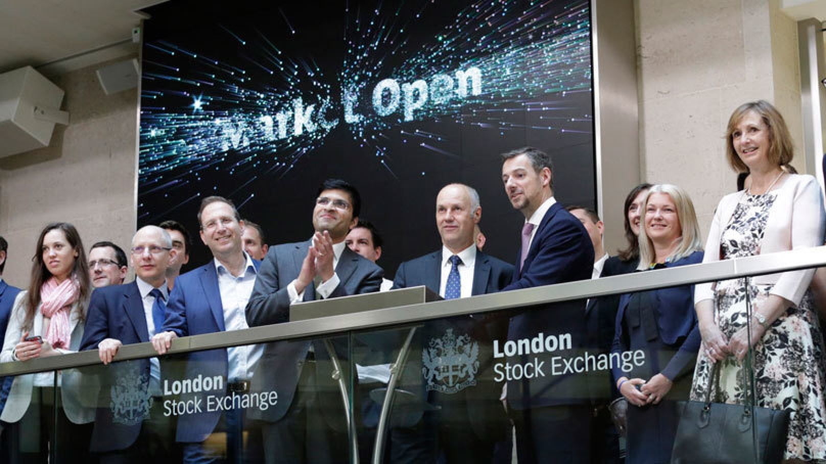 Alfa colleagues gathered on a balcony at the London Stock Exchange