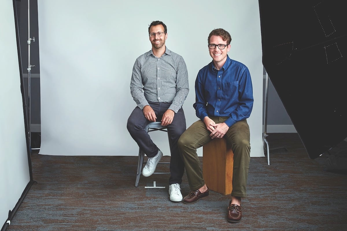 Ali Javid, left, and Wrapbook co-founder Cameron Woodward seated in a photography studio