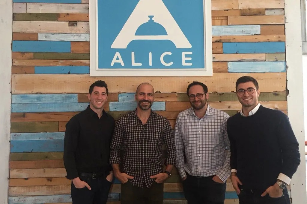 Justin Effron, Dara Khosrowshahi, Dmitry Koltunov, and Alexander Shashou standing together at ALICE’s office