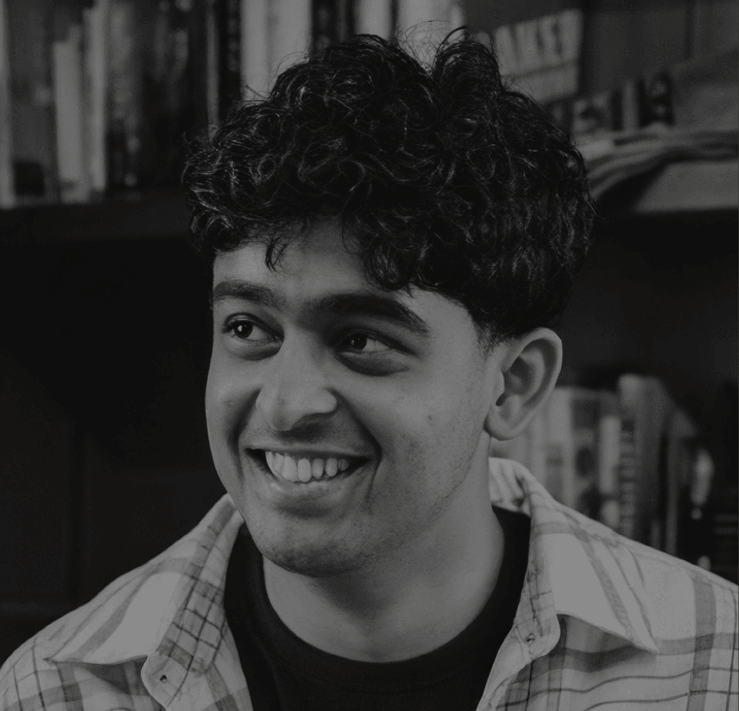 Omar Waseem, founder of Alif, smiling in a black-and-white portrait