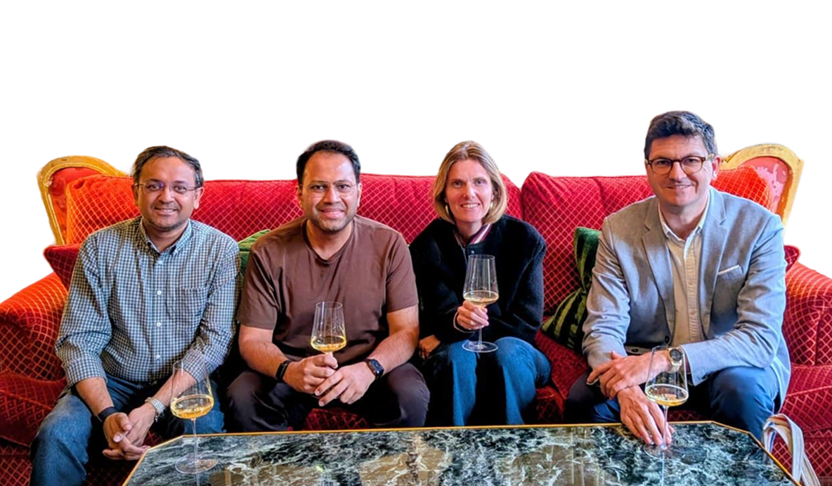 The four Wingify founders seated together on a red sofa, including Alix de Sagazan